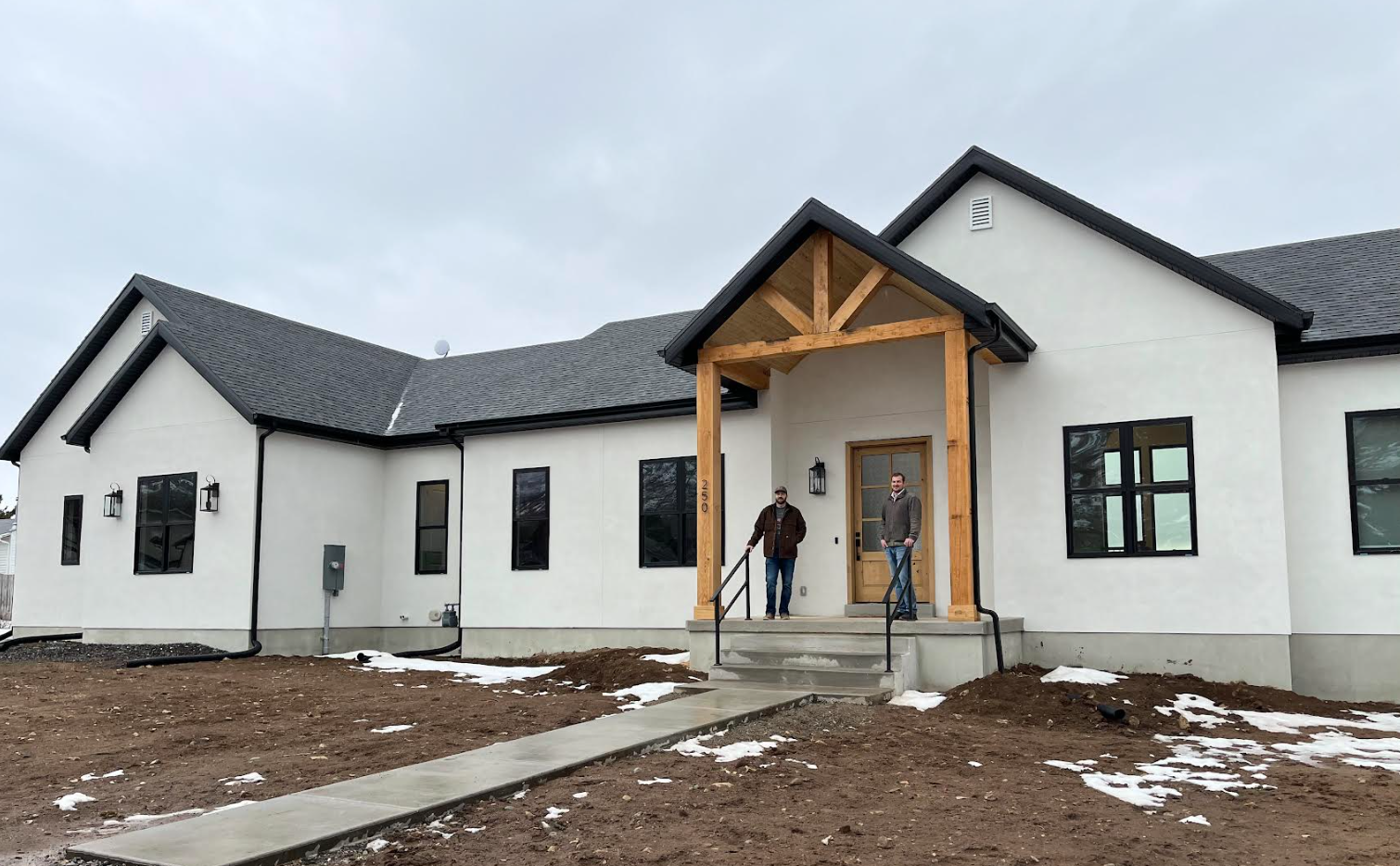 Joe and Matt on the porch of a recently completed GRT Builders custom home